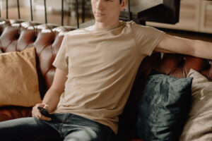 guy in basic tan t-shirt with jeans on